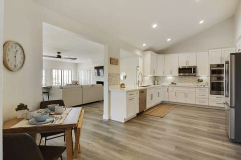 Kitchen nook with a breakfast table that folds out and can seat 6-8 people.