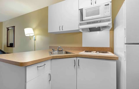 Fridge, microwave, stovetop, coffee/tea maker