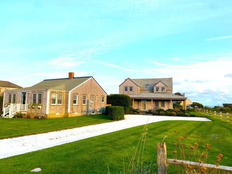 Cottage on left; bunk house in middle/background; main house on right
