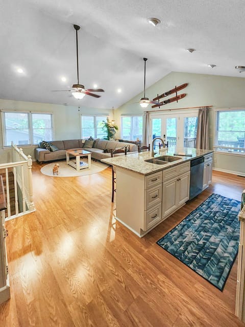 Walking in from our side door into the main living room and open kitchen.