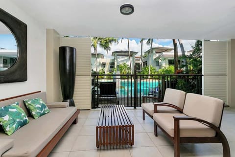 Relax and unwind on the balcony while soaking in pool and garden views with your group.