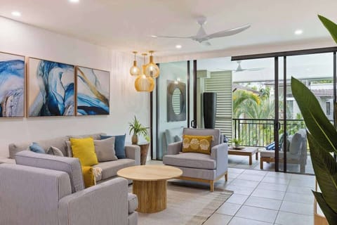 Relax in a spacious living room equipped with both air-conditioning and a ceiling fan for utmost comfort. The sofa bed can be set up to sleep one child.