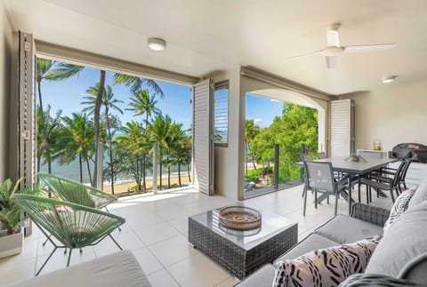Enjoy uninterrupted ocean views between swaying palms from your private balcony.