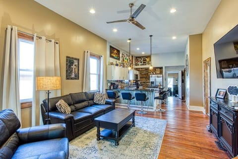 12 foot ceilings, open floor plan, original hardwood floors, stainless steel ceiling fans