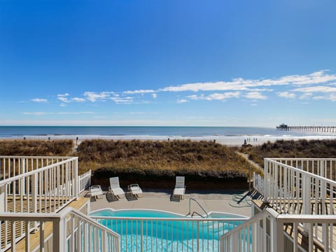 Private oceanfront pool with sundeck seating