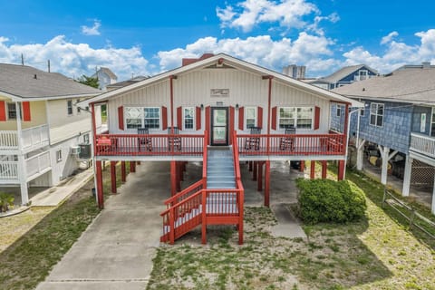 Relax on the back deck and enjoy peaceful views of the Cherry Grove inlet channel.