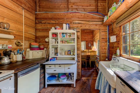 Pantry items, some plates and bowls, utensils
