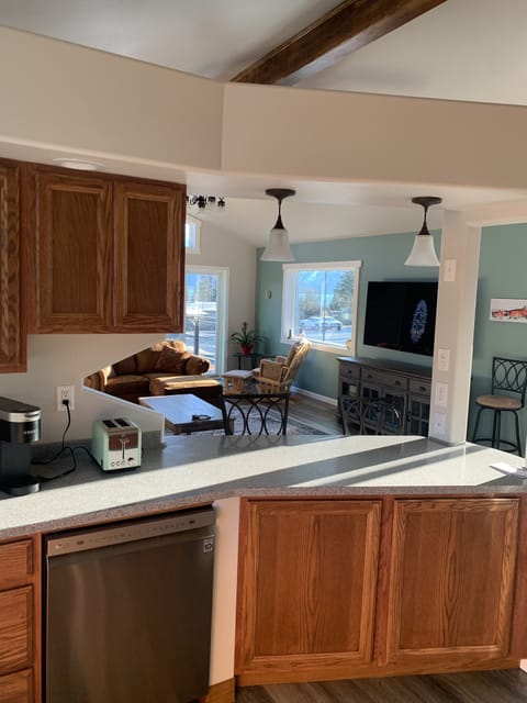 In kitchen facing living area 
