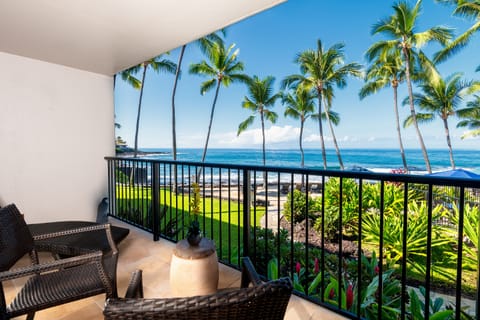 Ocean and Sunset views. Spacious lanai overlooking the ocean, saltwater pool, and coastline — perfect for morning coffee or sunset relaxation.