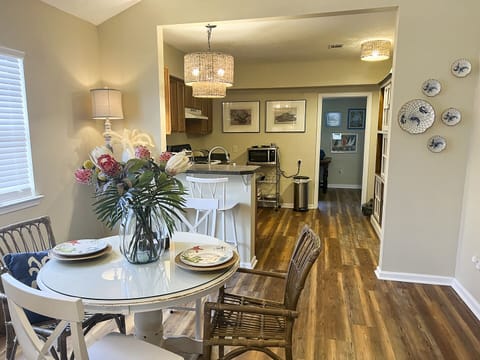 Dining area. Table for  four and 2 bar stools.