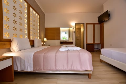 Superior Triple Room | Minibar, in-room safe, desk, soundproofing