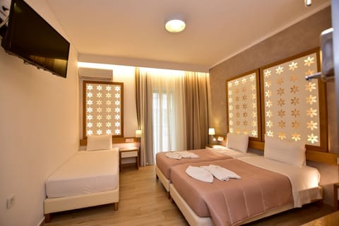 Superior Triple Room | Minibar, in-room safe, desk, soundproofing