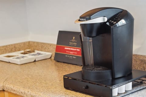 The first floor has a full kitchen outfitted with a Keurig and coffee pods.