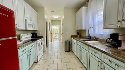 Fully equipped modern kitchen with retro refrigerator