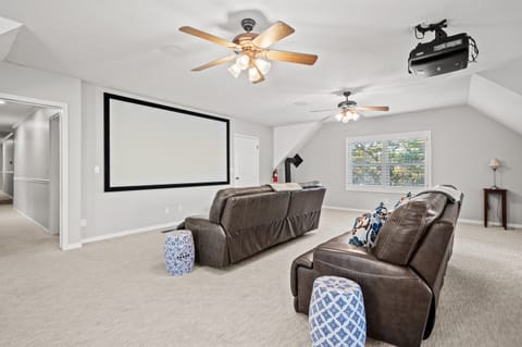 A theater room, hot tub, ping pong table, foosball, are all yours to enjoy.