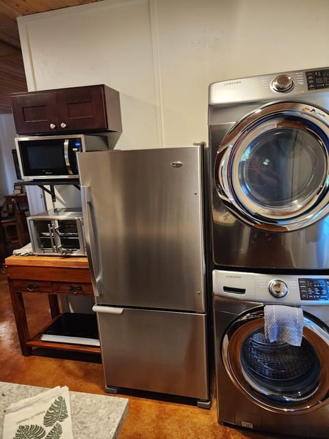 Microwave, CookTron induction cooktop, toaster oven, large fridge, washer, dryer
