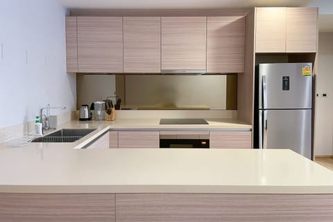 Open kitchen, fully equipped with kettle, coffee machine and washing machine