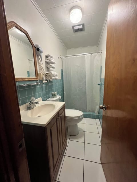 Room, 2 Double Beds | Bathroom | Free toiletries, hair dryer, towels