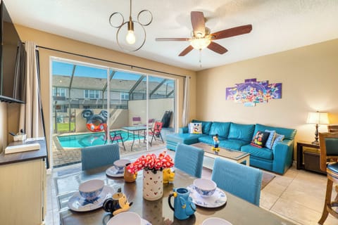 Gather 'round where the magic doesn't end. Our living room is a plush, blue haven for tired theme park legs. Here, every cushion whispers a Disney secret, and every wall tells a story.