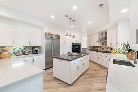 The kitchen is spacious enough for all your friends and family to pitch in with diner or hang out as you cook