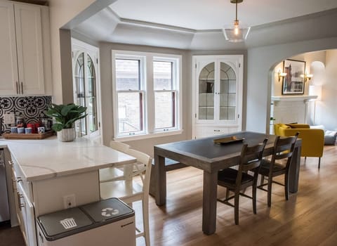 A look at a bit the kitchen and the dining room, going into the living room.