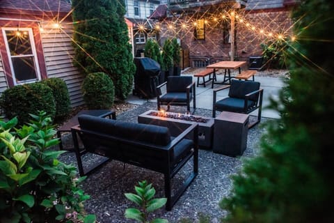 We enjoy this backyard space for family dinners outside, and cuddling around the fire when the sun goes down. We also have a game of cornhole to entertain the kids while we fire up the grill.