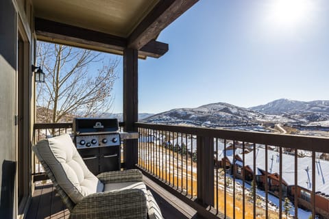 - Balcony retreat with cushioned seating and mountain views  
- Outdoor grill ready for BBQs with a scenic backdrop  
- Sunshine and fresh alpine air create the perfect escape