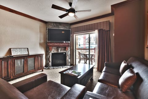 - Gather in the living room with leather seating and fireplace  
- Step outside to the balcony for fresh alpine air and views  
- Watch shows on the flat-screen TV in a cozy rustic space