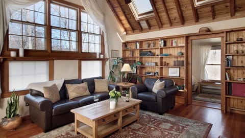 The loft also overlooks the spacious living room…
