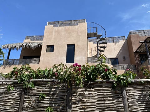 A front view of the villa showing all three levels.