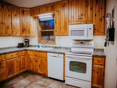 FULLY STOCKED KITCHEN INCLUDING LARGE UPRIGHT FREEZER FOR STORING YOUR FRESH CATCH