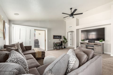 Comfortable living space with ample seating, Smart TV, dedicated work space