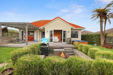 Front exterior with fire pit