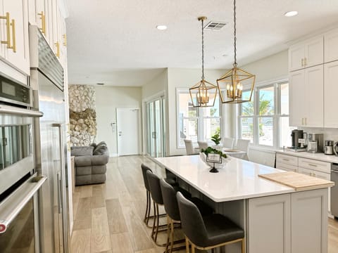Stunning designer kitchen with top notch appliances. Kitchen Island sits 6