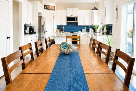 Family seating for 10 with an additional 3 seats at the counter.