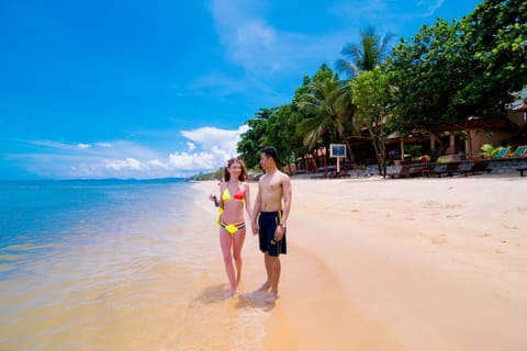 Private beach, white sand, sun loungers, beach umbrellas