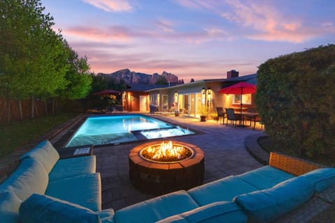 Back yard with firepit, heated pool, and hot tub!