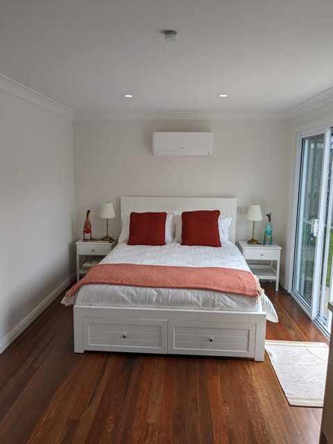 The queen size bed with reverse cycle air conditioning.