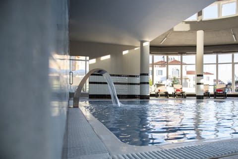 Indoor pool, seasonal outdoor pool, pool umbrellas, sun loungers
