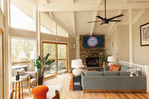 Our great room on the second floor is filled with sunlight and a 65" TV over the (decorative) fireplace. 