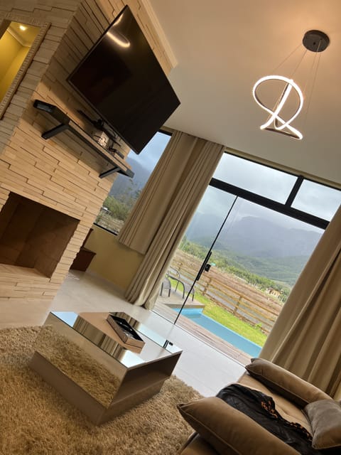 Romantic Chalet | Living area | 50-inch Smart TV with digital channels, TV, fireplace