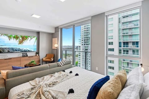 Living/sleeping area w/ king bed, 65" Smart TV - Capturing the amazing views of the city from your own spot at this charming studio apartment.