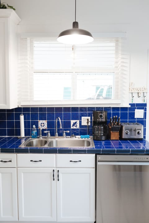 Kitchen sink with garbage disposal, coffee maker, knife set and toaster