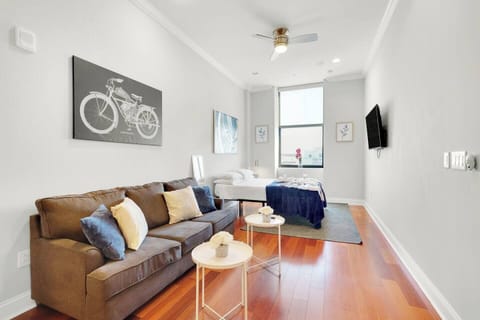 Spacious Northern Liberties studio with open living area, full kitchen, modern bathroom, and designer furnishings throughout.