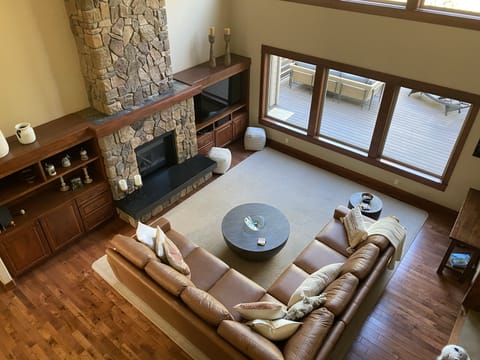 Spacious living room with indoor fireplace. Perfect for relaxation.