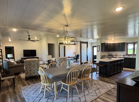 Enjoy meals together at our dining table for 8, plus space for 4 at the peninsula—perfect for gatherings