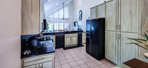 Fully stocked kitchen with essential appliances & flatware