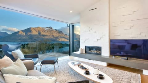 Lounge with feature sliding doors that open out to the balcony and the view