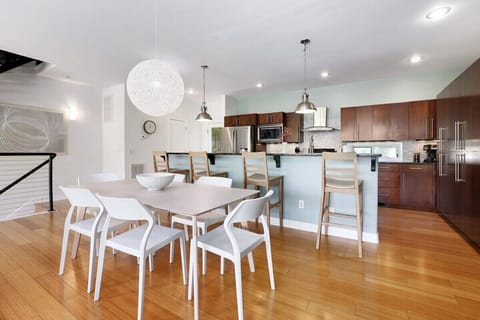 Between the kitchen and living room, you'll find our large dining room table with seating for 6.