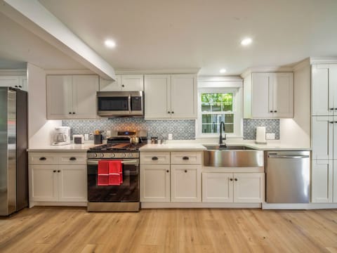 Fully equipped new kitchen with toaster, coffee maker, microwave, & dishwasher